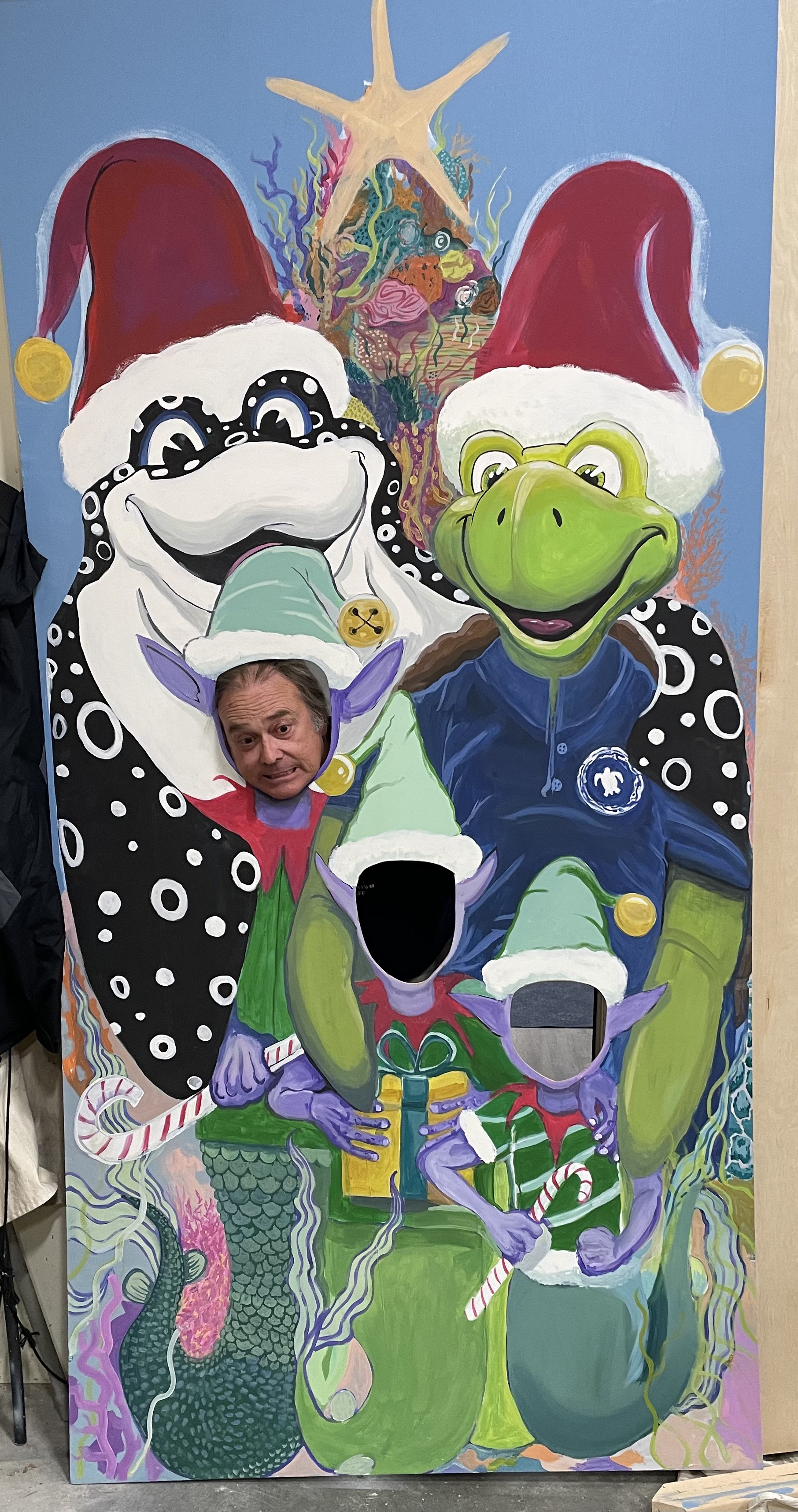 Christmas photo op mural prop featuring Aquarium mascots